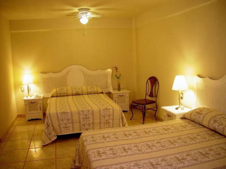 Capital O Hotel Suites Andrade Leon Exterior photo