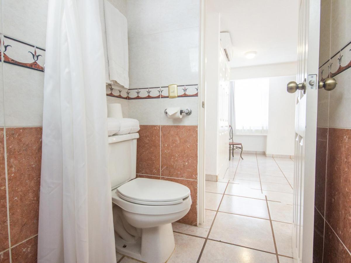 Capital O Hotel Suites Andrade Leon Exterior photo